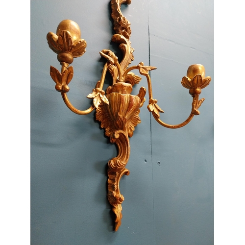 226 - Pair of giltwood wall lights in the Rococo manner. {64 cm H x 32 cm W x 17 cm W}.