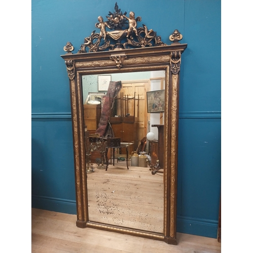 229 - 19th C. French gilt mirror surmounted with cherubs, foliage and fruit. {180 cm H x 96 cm W}.