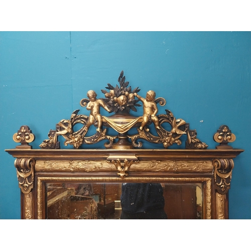 229 - 19th C. French gilt mirror surmounted with cherubs, foliage and fruit. {180 cm H x 96 cm W}.