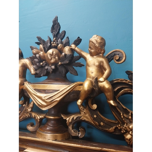 229 - 19th C. French gilt mirror surmounted with cherubs, foliage and fruit. {180 cm H x 96 cm W}.