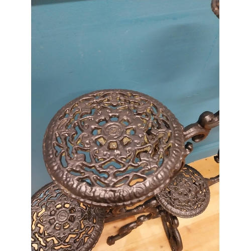 239 - Decorative cast iron plant stand. {101 cm H x 92 cm W x 50 cm D}.