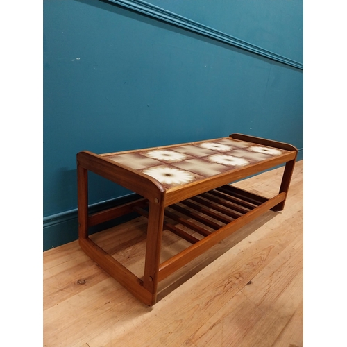 240 - Retro teak coffee table with inset tiled top. {43 cm H x 115 cm W x 45 cm D}.