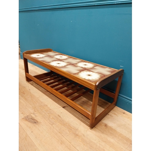 240 - Retro teak coffee table with inset tiled top. {43 cm H x 115 cm W x 45 cm D}.