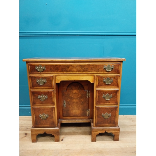 241 - Burr walnut lowboy in the Georgian style with single long drawer in frieze and eight short drawers w... 