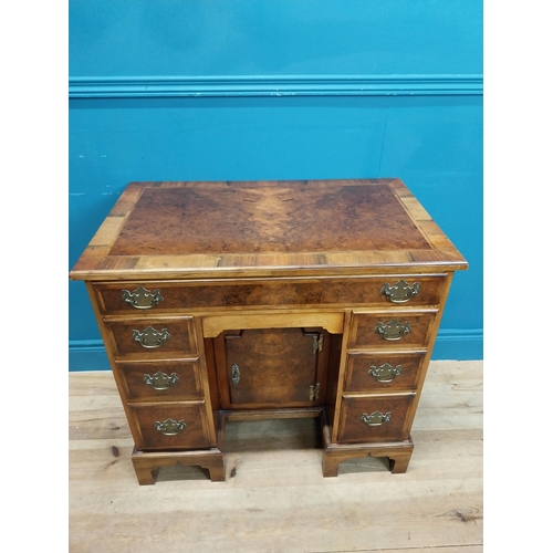 241 - Burr walnut lowboy in the Georgian style with single long drawer in frieze and eight short drawers w... 