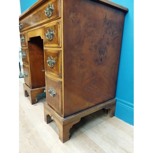 241 - Burr walnut lowboy in the Georgian style with single long drawer in frieze and eight short drawers w... 