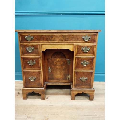 241 - Burr walnut lowboy in the Georgian style with single long drawer in frieze and eight short drawers w... 