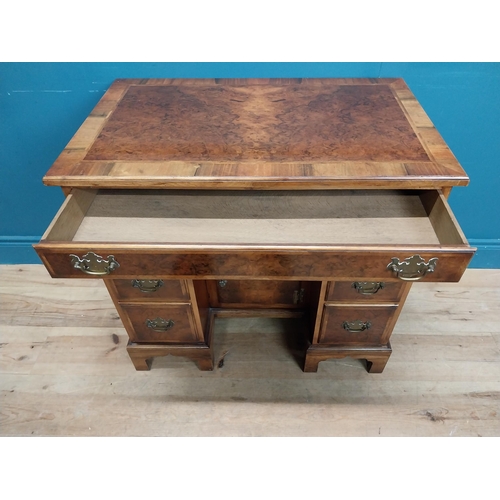 241 - Burr walnut lowboy in the Georgian style with single long drawer in frieze and eight short drawers w... 