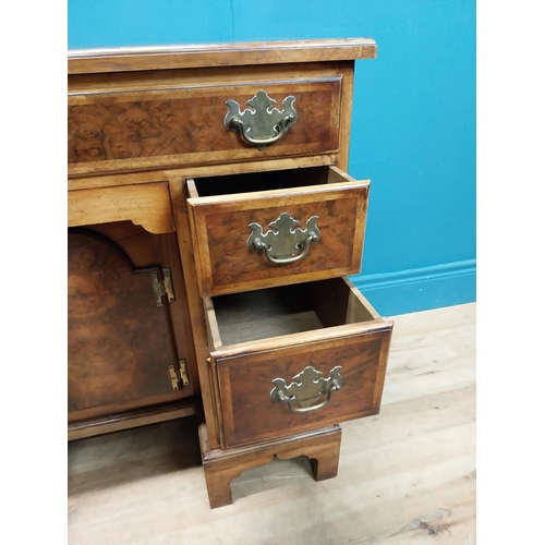 241 - Burr walnut lowboy in the Georgian style with single long drawer in frieze and eight short drawers w... 