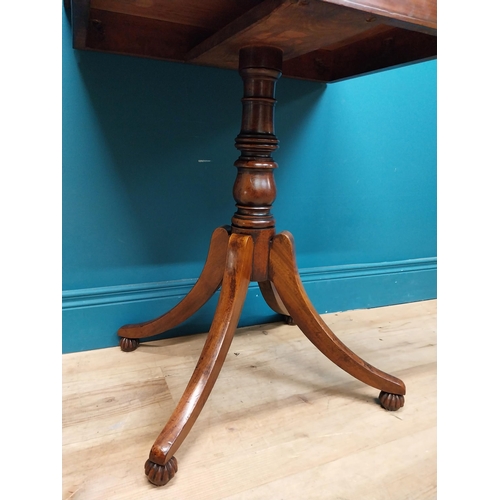 247 - 19th C. mahogany occasional table  on turned column with four outswept feet. {74 cm H x 61 cm W x 45... 