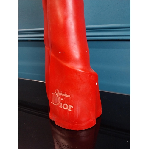 274 - Christian Dior plaster advertising figure with red gloves. {58 cm H x 19 cm W x 14 cm D}.