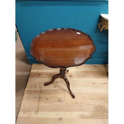 280 - 20th C. mahogany wine table with shaped top on turned column with three outswept legs. {72 cm H x 59... 