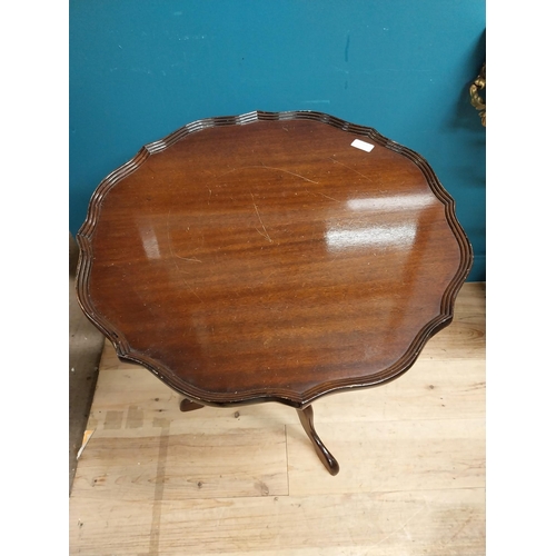 280 - 20th C. mahogany wine table with shaped top on turned column with three outswept legs. {72 cm H x 59... 