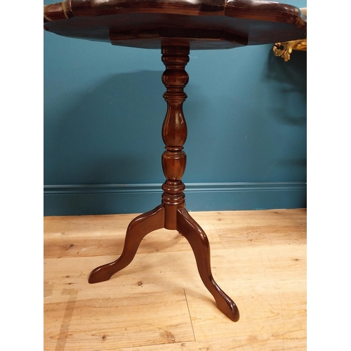 280 - 20th C. mahogany wine table with shaped top on turned column with three outswept legs. {72 cm H x 59... 