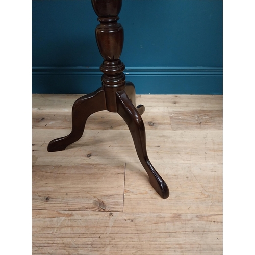 280 - 20th C. mahogany wine table with shaped top on turned column with three outswept legs. {72 cm H x 59... 