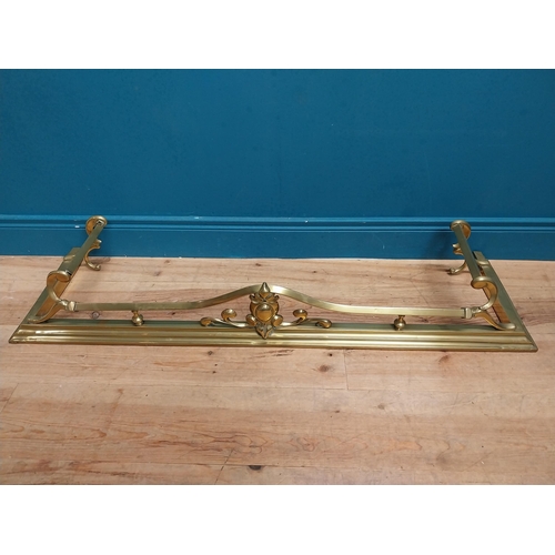 283 - Art Nouveau brass fire fender. {20 cm H x 123 cm W  x 36 cm D}.