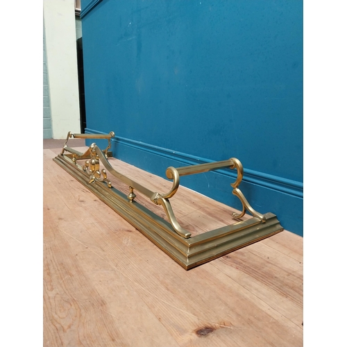 283 - Art Nouveau brass fire fender. {20 cm H x 123 cm W  x 36 cm D}.