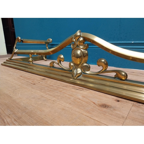 283 - Art Nouveau brass fire fender. {20 cm H x 123 cm W  x 36 cm D}.