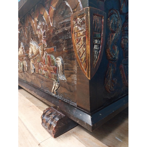 294 - Unusual carved and painted pine trunk with jousting horses and shield decoration in front and side p... 