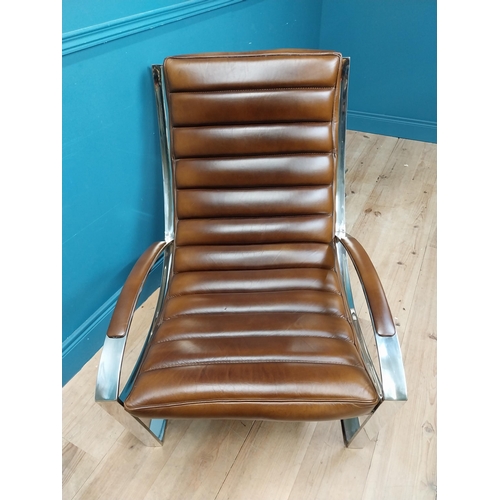 305 - Exceptional quality leather and chrome lounging armchair and matching footstool in the Art Deco styl... 