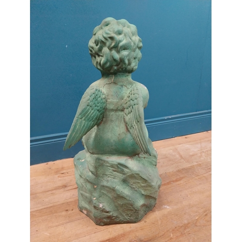 308 - Resin model of Angel seated on rock. {64 cm H x 49 cm W x 49 cm D}.