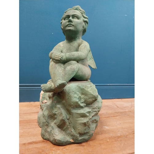 308 - Resin model of Angel seated on rock. {64 cm H x 49 cm W x 49 cm D}.