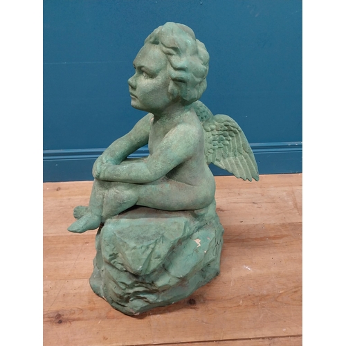 308 - Resin model of Angel seated on rock. {64 cm H x 49 cm W x 49 cm D}.