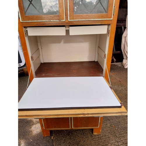 320 - 1950's kitchen cupboard with two doors over two short drawers, pull down door with glazed doors and ... 