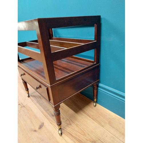 337 - Georgian mahogany canterbury raised on four turned legs with brass casters and single drawer. {51 cm... 