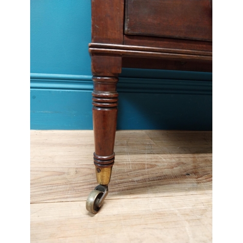 337 - Georgian mahogany canterbury raised on four turned legs with brass casters and single drawer. {51 cm... 