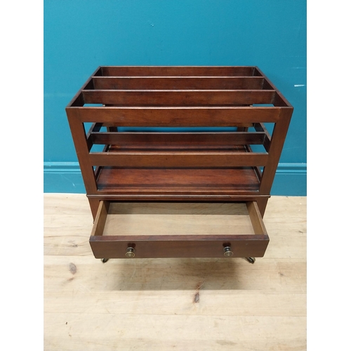 337 - Georgian mahogany canterbury raised on four turned legs with brass casters and single drawer. {51 cm... 