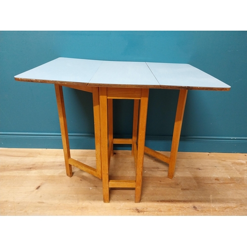 339 - Retro kitchen table with drop down sides and Formica top. {73 cm H x 61 cm W x 31 cm D}.