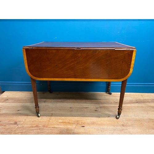 355 - Regency mahogany and satinwood drop leaf table. {72 cm H x 91 cm W x 60 cm D}.