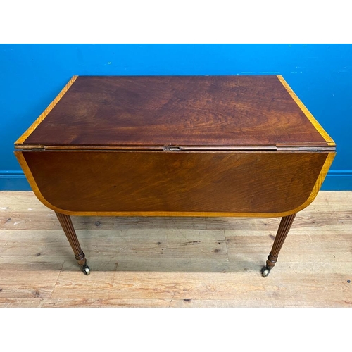 355 - Regency mahogany and satinwood drop leaf table. {72 cm H x 91 cm W x 60 cm D}.