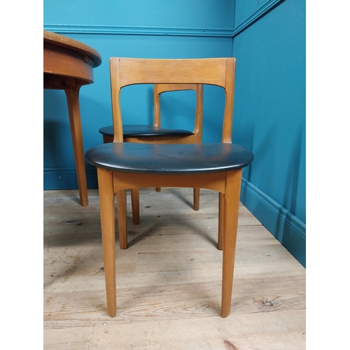 362 - Mid century teak dining table with pull out central leaf and four matching upholstered chairs. Table... 