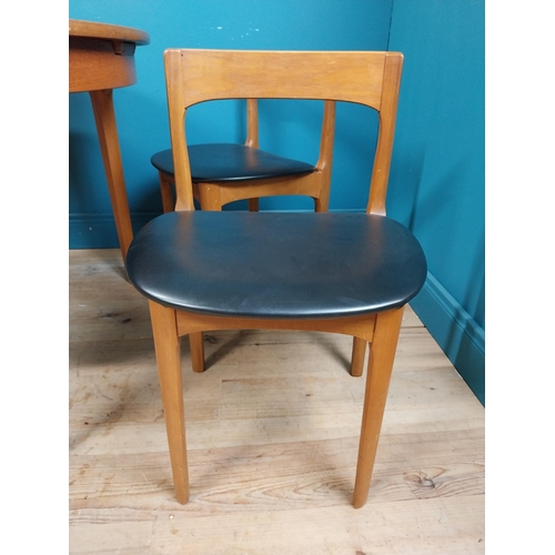 362 - Mid century teak dining table with pull out central leaf and four matching upholstered chairs. Table... 