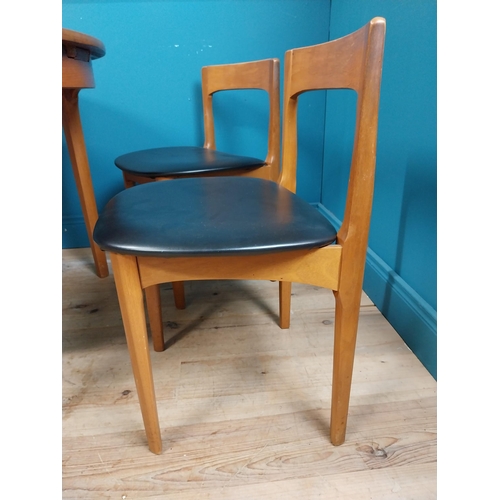 362 - Mid century teak dining table with pull out central leaf and four matching upholstered chairs. Table... 