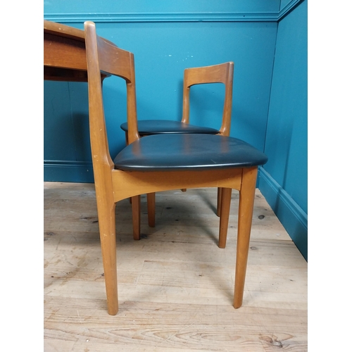 362 - Mid century teak dining table with pull out central leaf and four matching upholstered chairs. Table... 