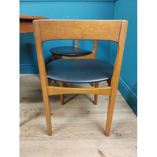 362 - Mid century teak dining table with pull out central leaf and four matching upholstered chairs. Table... 