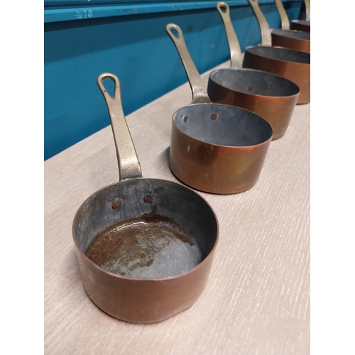 38 - Set of six copper and brass saucepans {Smallest: 8cm H x 16cm W x 16cm D and Largest: 18cm H x 32cm ... 