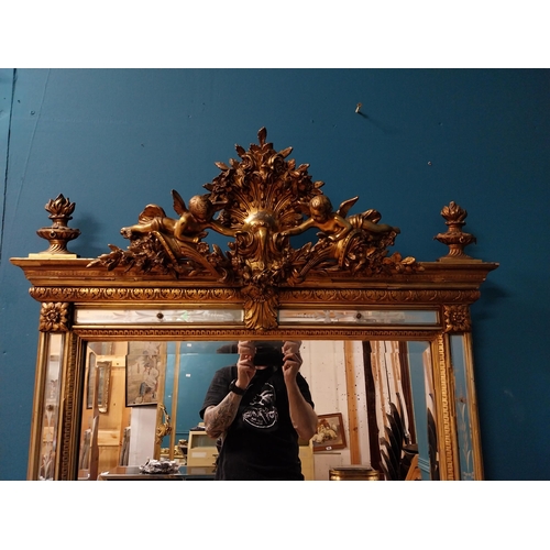 390 - 19th C. French gilt mirror with floral decoration and etched surrounds surmounted with cherubs. {180... 