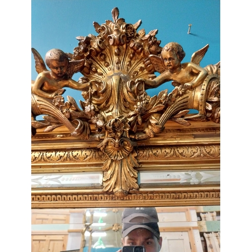 390 - 19th C. French gilt mirror with floral decoration and etched surrounds surmounted with cherubs. {180... 