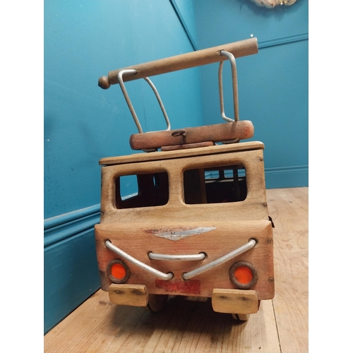 391 - 1950's Dejou wooden ride along toy in the form of a bus tram. {38 cm H x 70 cm W x 24 cm D}.