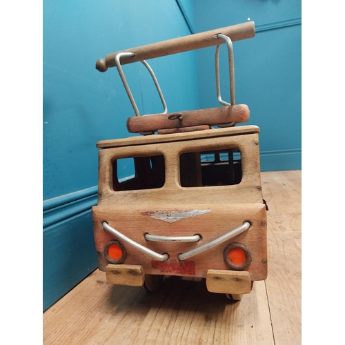 391 - 1950's Dejou wooden ride along toy in the form of a bus tram. {38 cm H x 70 cm W x 24 cm D}.