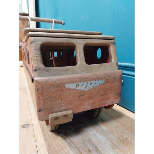 391 - 1950's Dejou wooden ride along toy in the form of a bus tram. {38 cm H x 70 cm W x 24 cm D}.