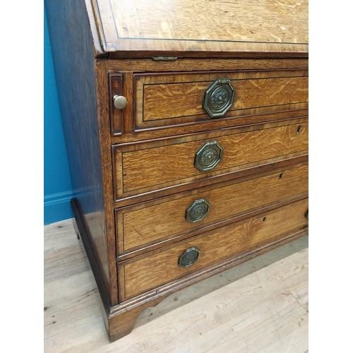 397 - Georgian oak bureau bookcase with fitted red velvet interior on bracket feet above two glazed doors.... 