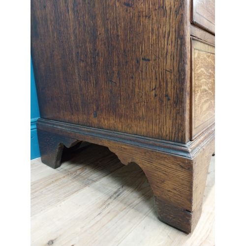 397 - Georgian oak bureau bookcase with fitted red velvet interior on bracket feet above two glazed doors.... 