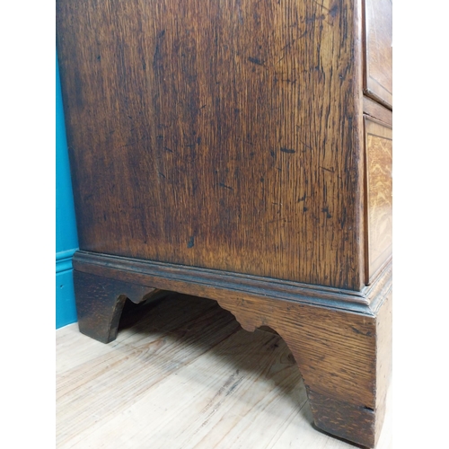 397 - Georgian oak bureau bookcase with fitted red velvet interior on bracket feet above two glazed doors.... 