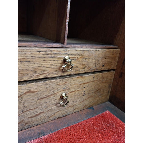 397 - Georgian oak bureau bookcase with fitted red velvet interior on bracket feet above two glazed doors.... 