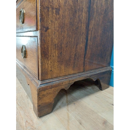 397 - Georgian oak bureau bookcase with fitted red velvet interior on bracket feet above two glazed doors.... 